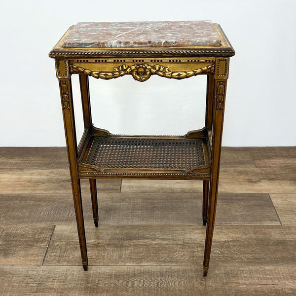 a french rococo style side table with a shelf for books and a shelf for books and other