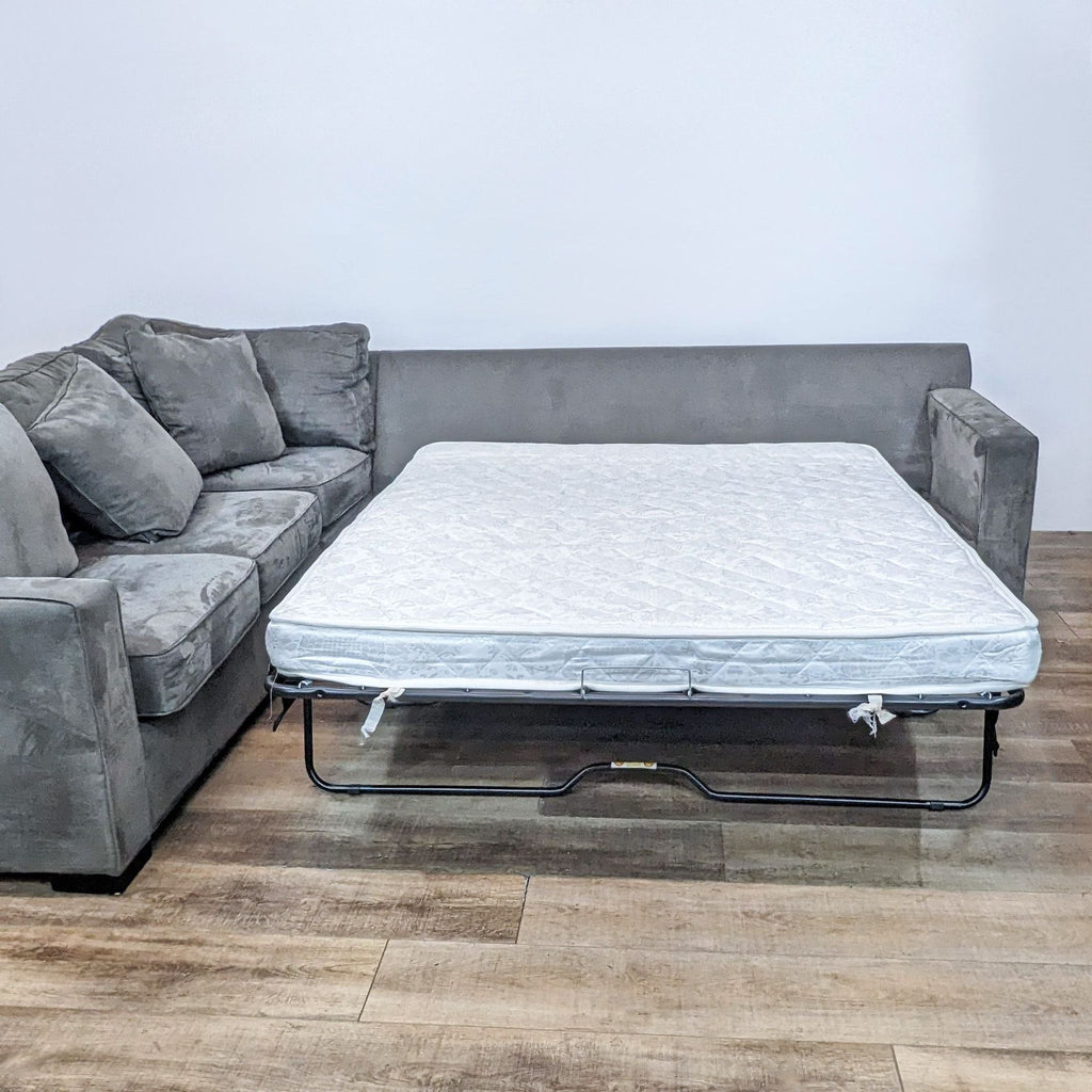 Graphite sectional with a pull-out queen sleeper.