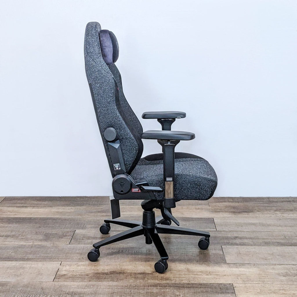 Side view of the Secretlab Titan Evo gaming chair showing its adjustable armrests and recline feature.