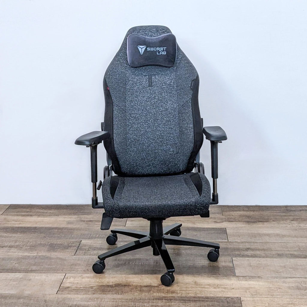 Front view of the grey Titan Evo gaming chair by Secretlab with a memory foam pillow.