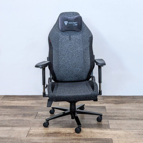 Front view of the grey Titan Evo gaming chair by Secretlab with a memory foam pillow.