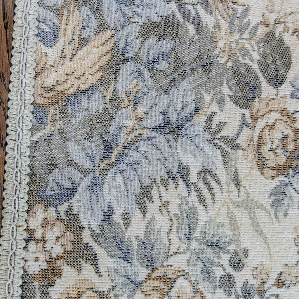 3. Detailed view of the fabric insert on a Reperch oak table with a pattern of blue and beige florals.