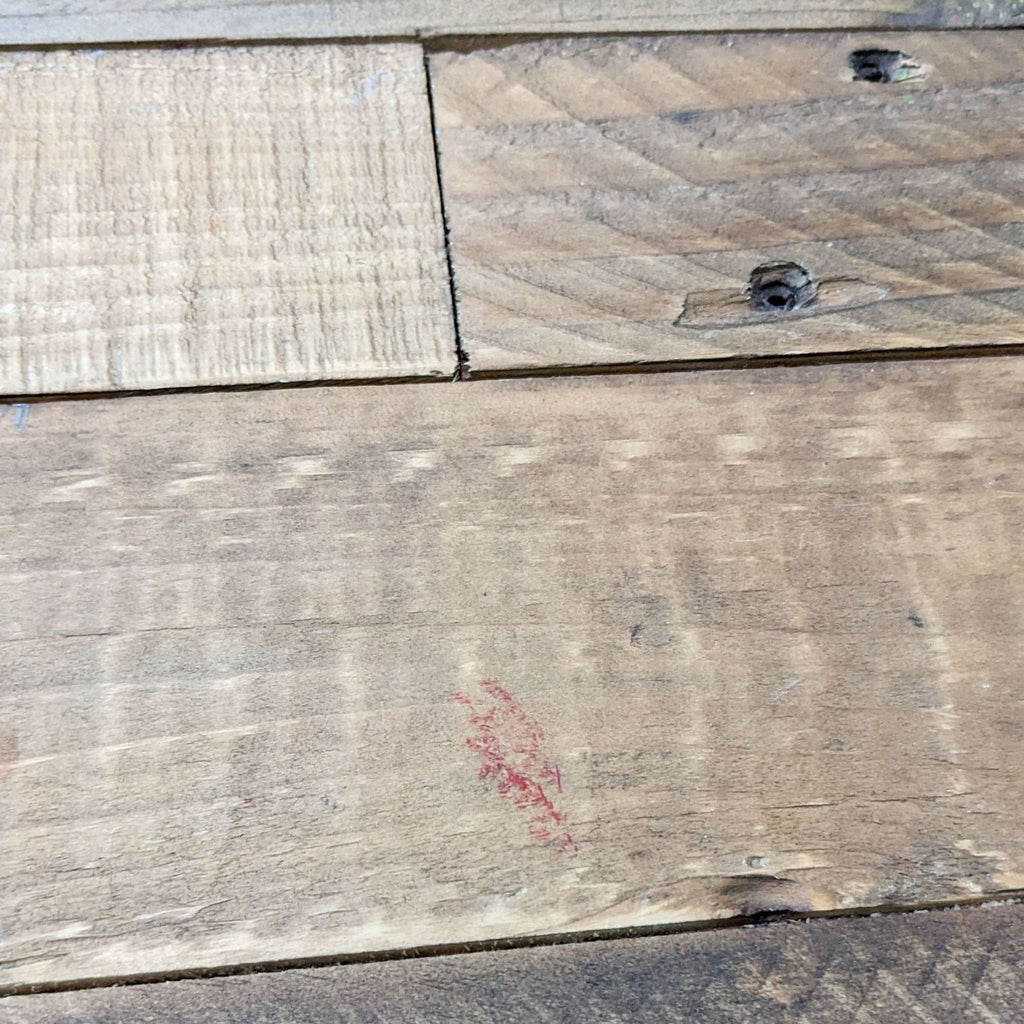 Close-up of wood grain detail and assembly marks on console table surface.