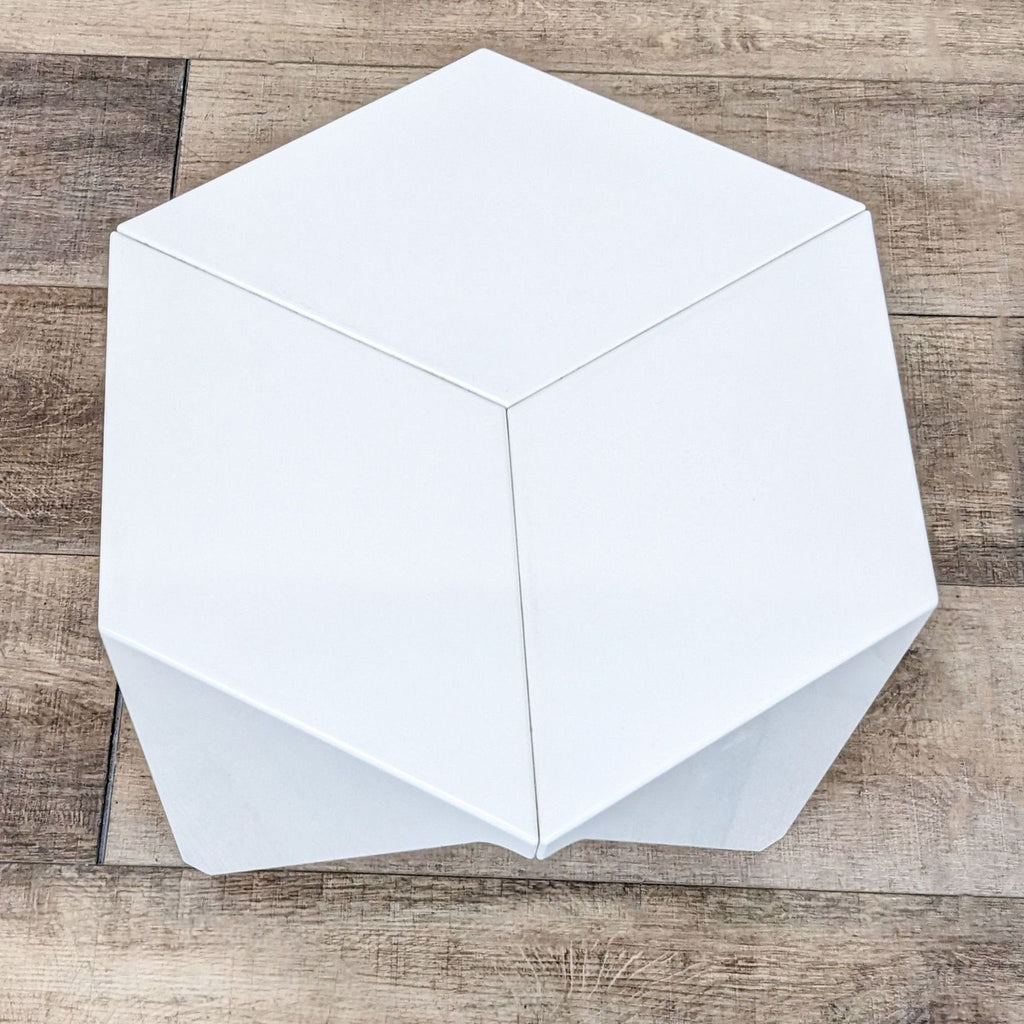 Isamu Noguchi Prismatic Table, sleek aluminum design with a modern look.