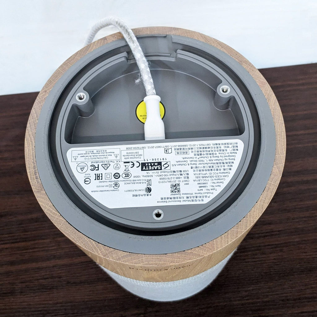 Bottom view of Bang & Olufsen Beosound Balance with connection details visible.