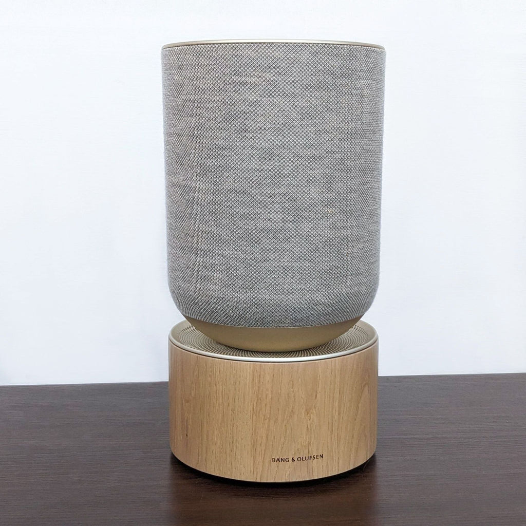 Bang & Olufsen Beosound Balance speaker with sleek design in a home setting.
