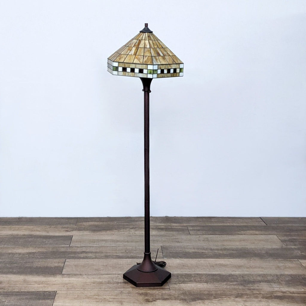 Reperch stained glass floor lamp with a geometric design shade.