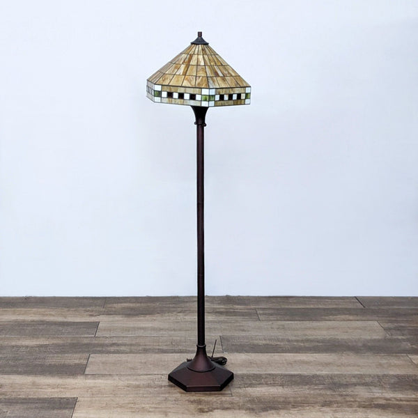 Reperch stained glass floor lamp with a geometric design shade.