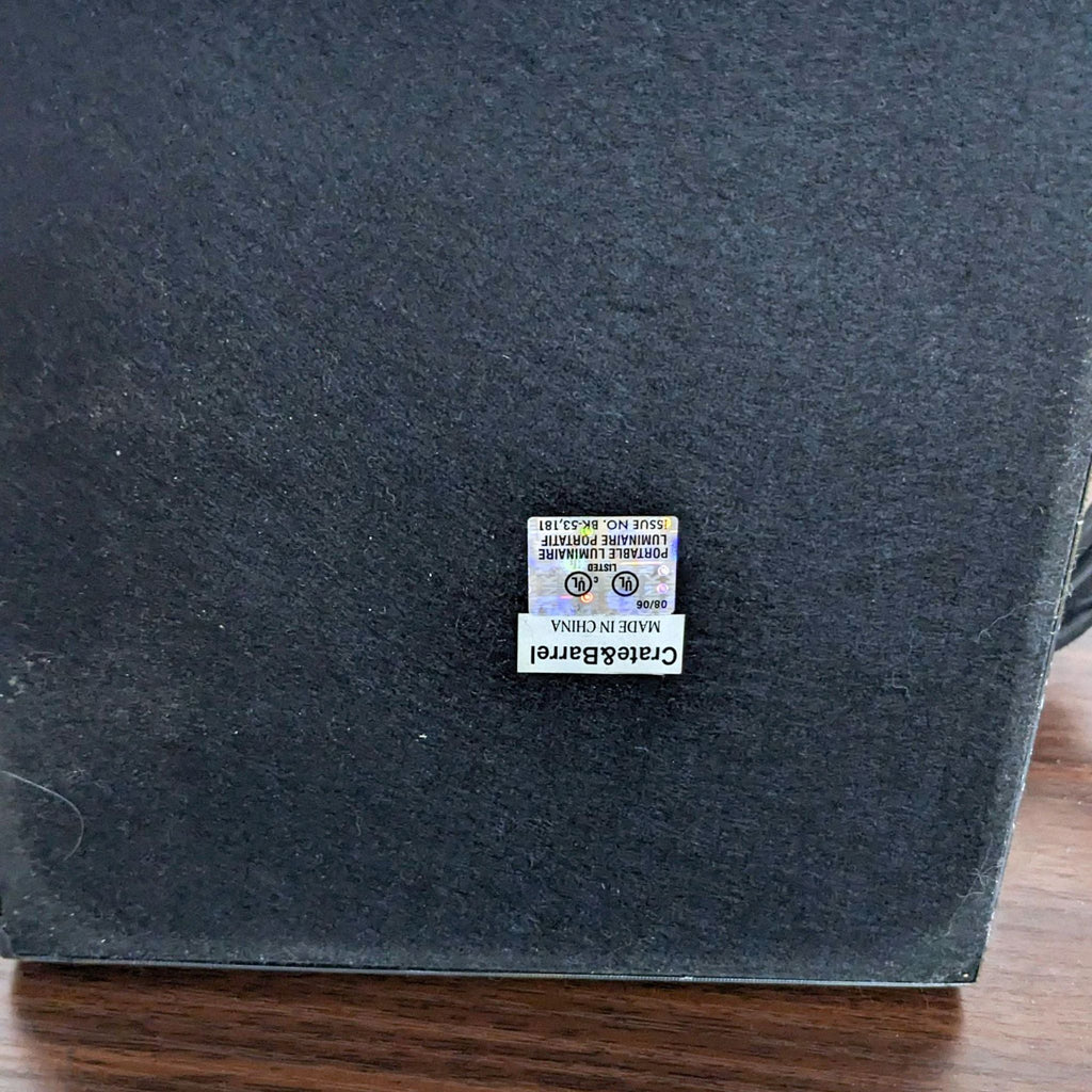 Underside label on Reperch lamp base, production details visible.