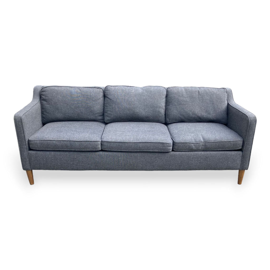 West Elm Hamilton sofa with narrow arms and wooden feet, inspired by 1950s design.
