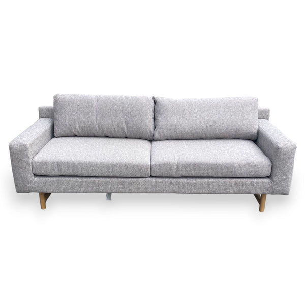 Sofa with gray fabric, block arms, and wood legs.