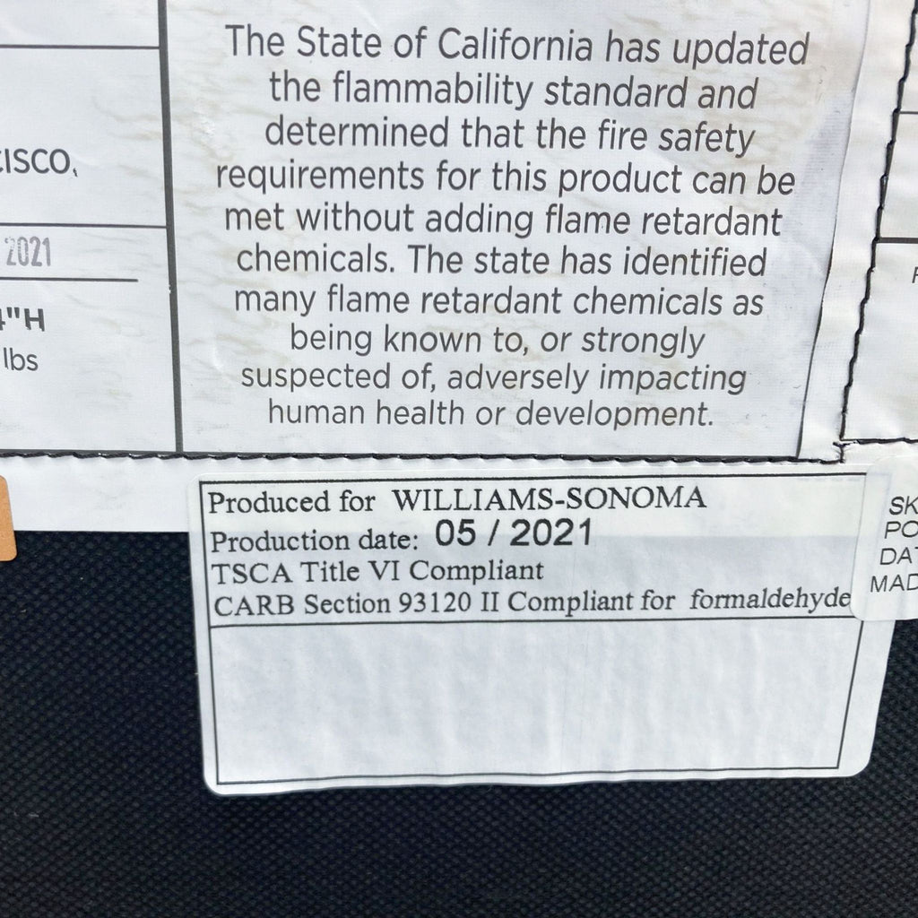 3. Label on a West Elm Axel Sectional Sofa indicating compliance with fire safety without the use of flame retardant chemicals.
