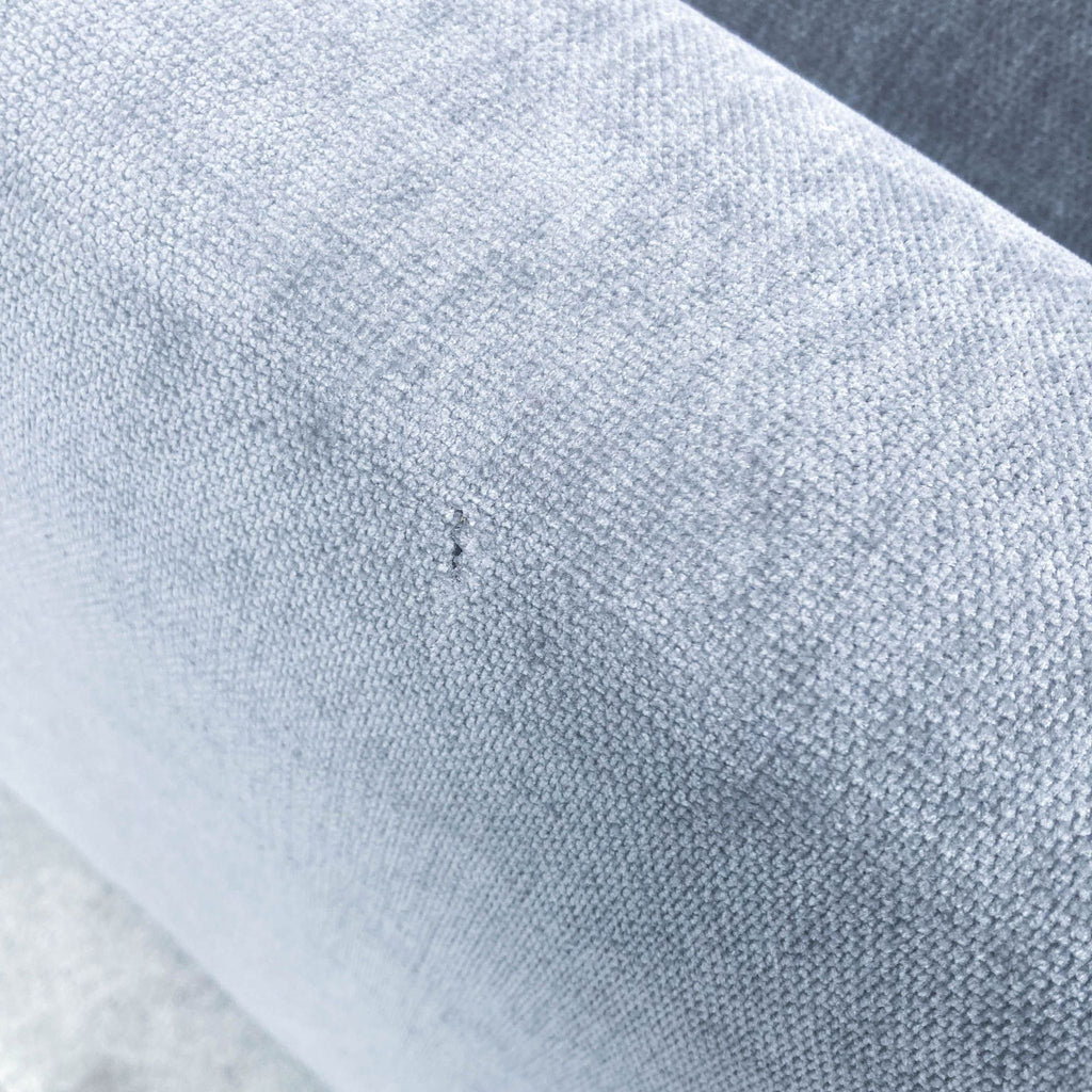Close-up of mineral grey distressed velvet material on a West Elm Andes Sectional, highlighting texture and quality.