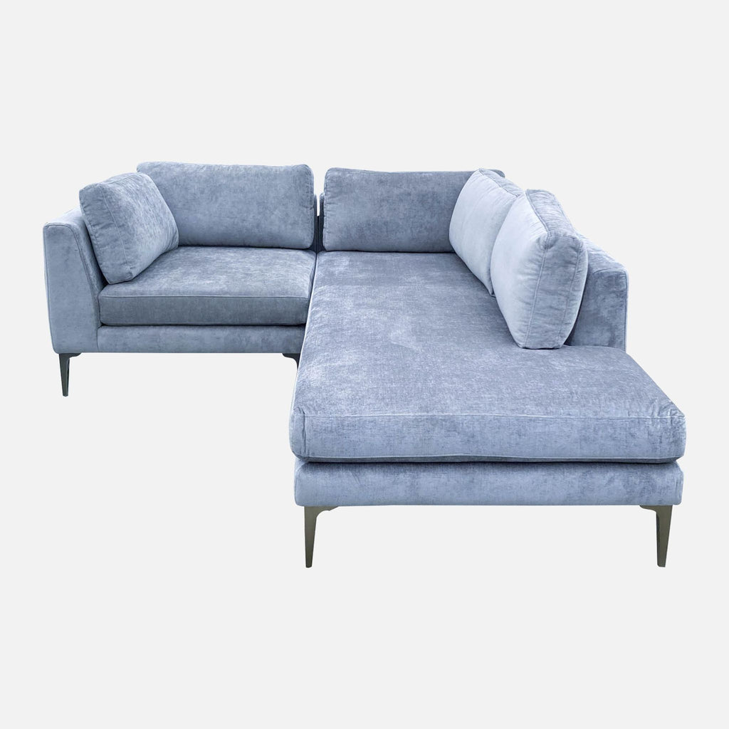 Modern grey velvet Andes Sectional by West Elm with elegant cast metal legs and a minimalist design.
