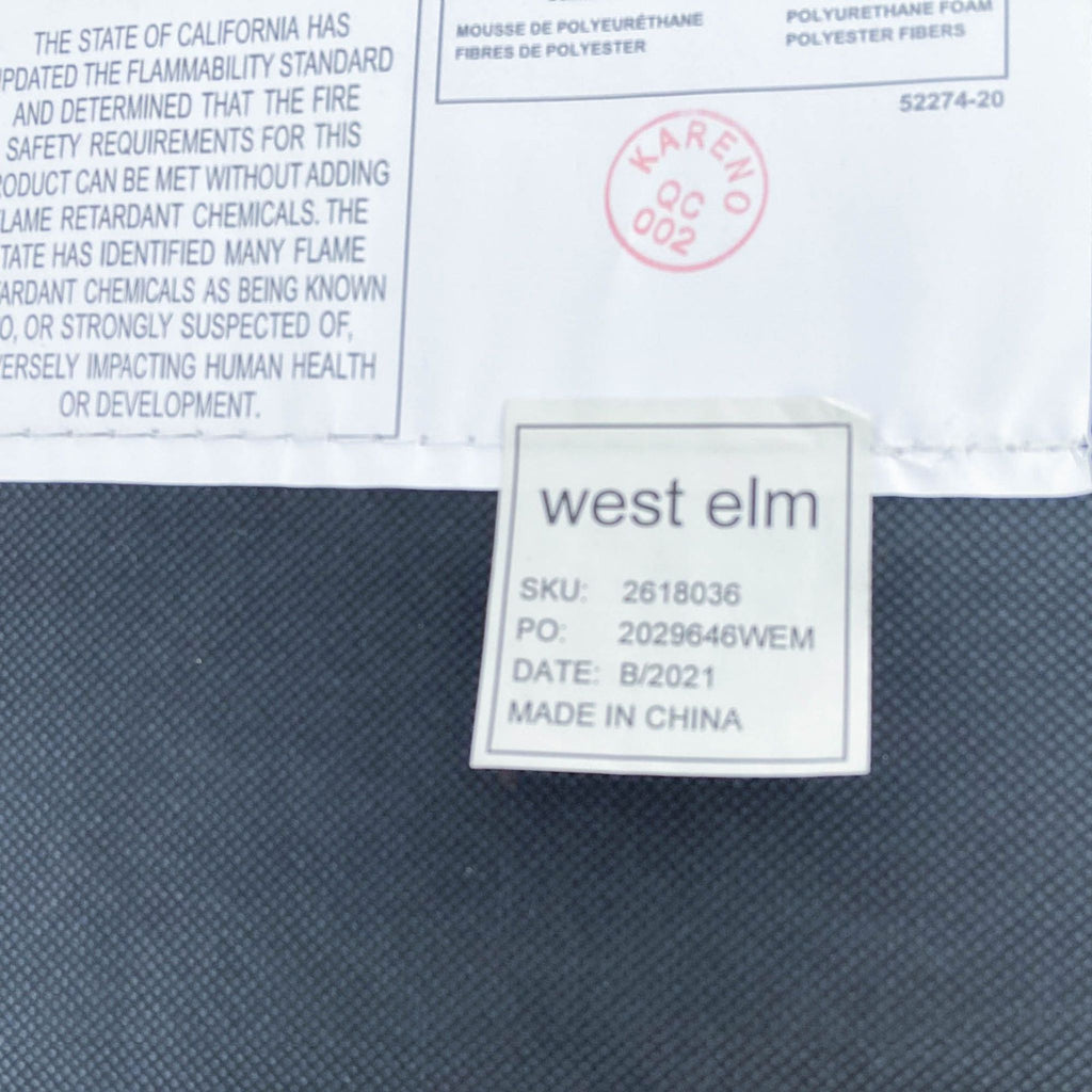 Product label for West Elm's Austin chair displaying SKU, manufacturing details, and compliance with safety standards.