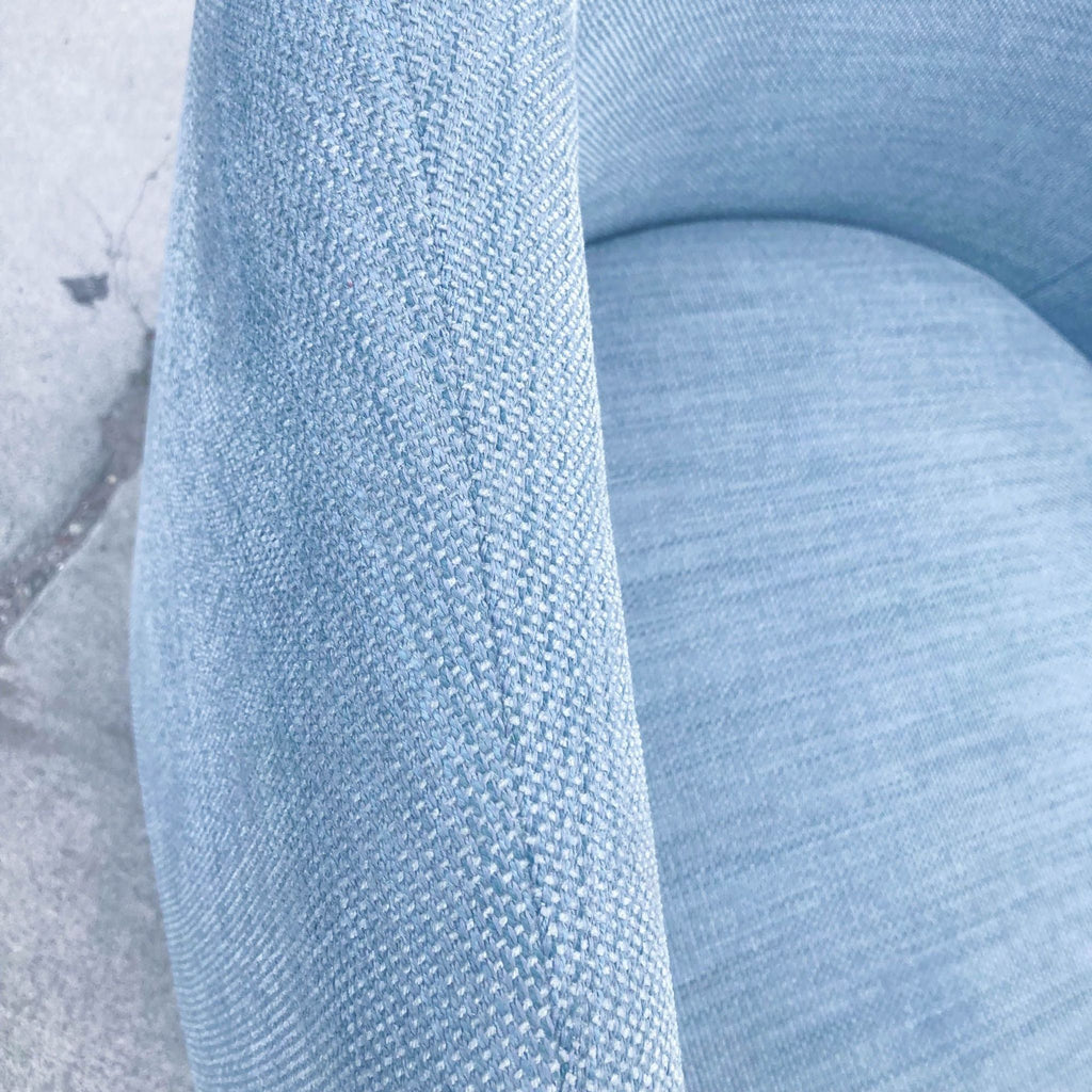 Close-up of the Crescent lounge chair’s blue performance basketslub fabric, highlighting the texture and stitching.  