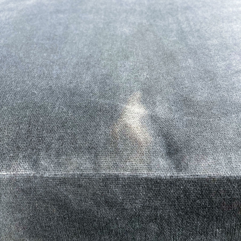 2. Close-up of the grey velvet upholstery on the West Elm Roar & Rabbit lounge chair seat cushion.