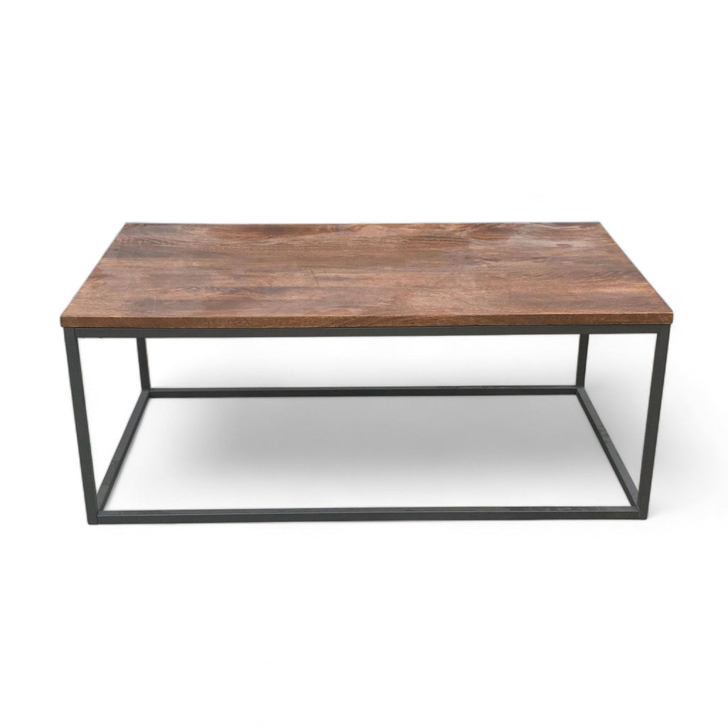 West Elm coffee table with mango wood top in walnut finish and black metal box frame.