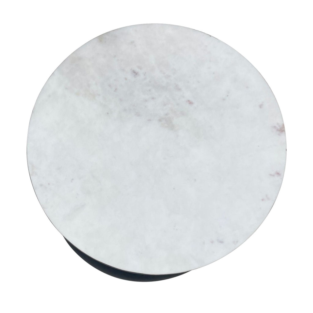 2. Top view of a CB2 marble surface side table showing the texture and finish.