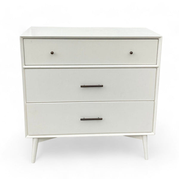 1. West Elm dresser with three drawers, angled legs, and contrasting hardware on a white background.