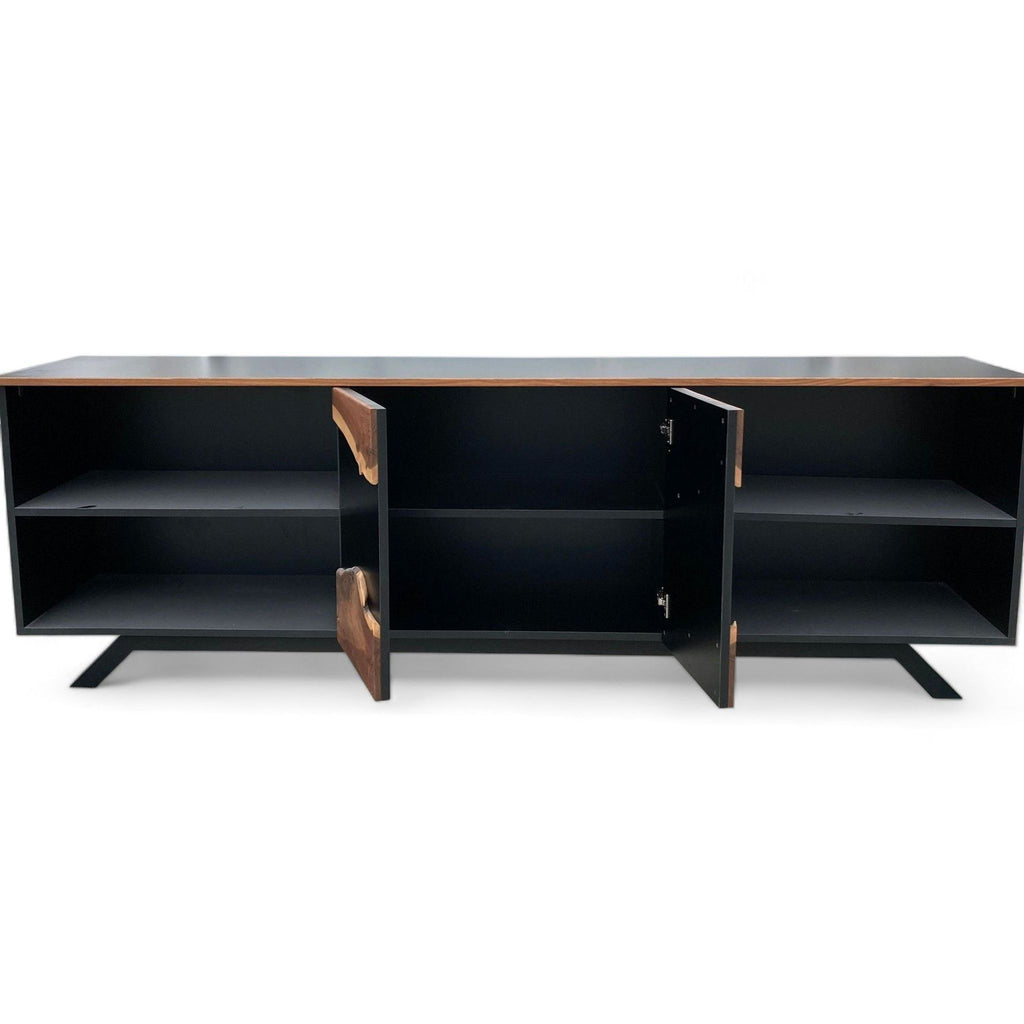 Open cabinet view of a Reperch sideboard showing spacious black interior shelves and distinctive wood door design.