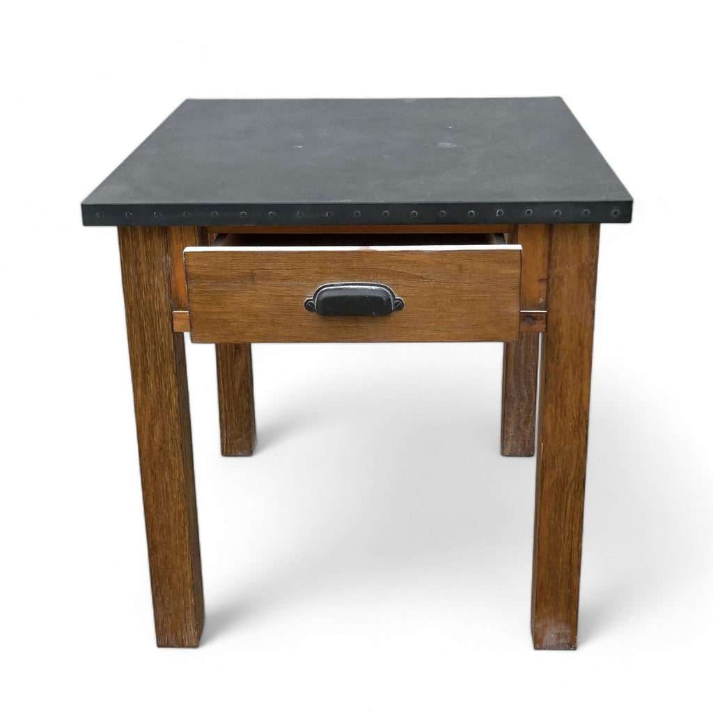 Square-shaped Reperch end table featuring a dark surface, single drawer with metal handle, and sturdy wooden legs.