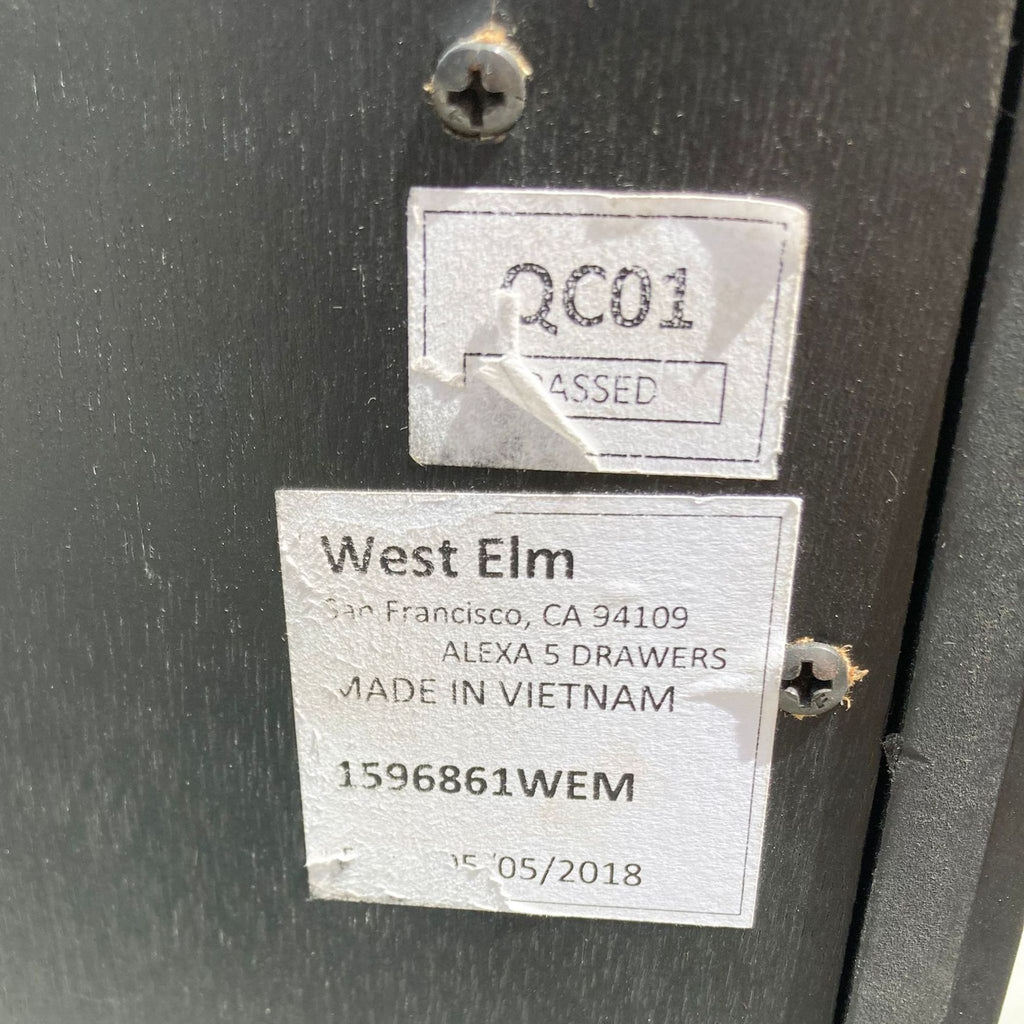 Label on the back of a West Elm dresser, made in Vietnam.