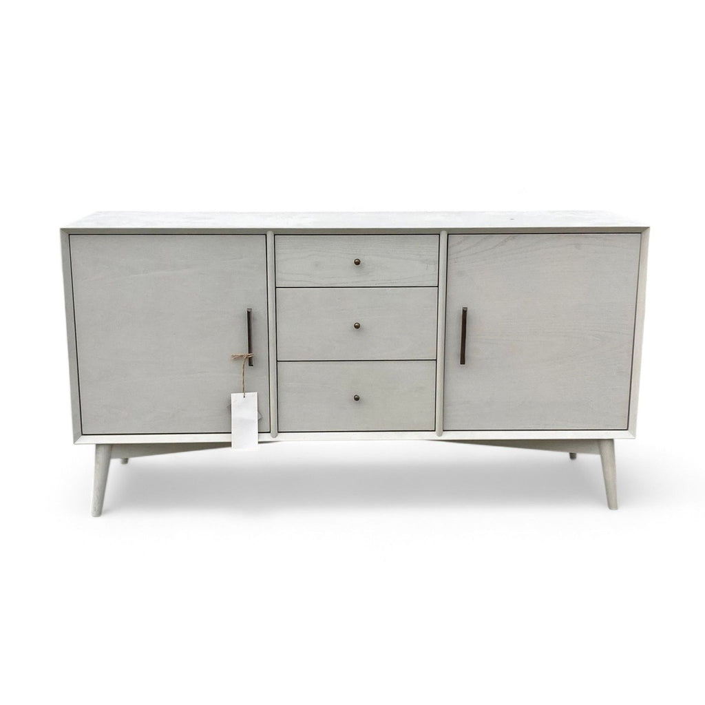 West Elm media console in Pebble with three drawers and two cabinets.