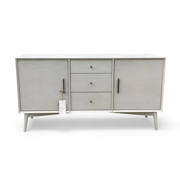 West Elm media console in Pebble with three drawers and two cabinets.
