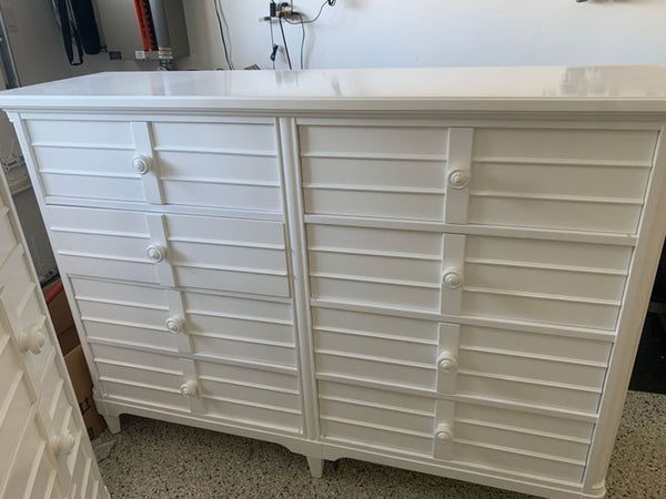 Stanley dresser with multiple drawers, designed in a classic wood style.  