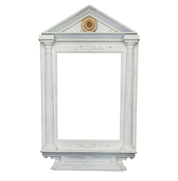 Victorian-style wooden architectural frame with fluted columns and intricate carvings in a white finish.