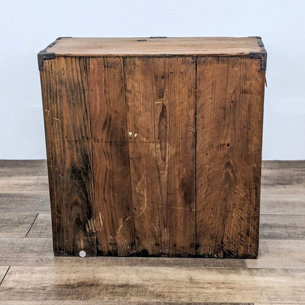 Back view of a wooden Japanese tansu cabinet.