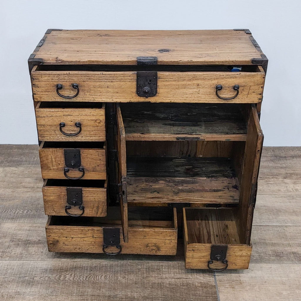 Open Japanese tansu cabinet revealing shelves and drawers.