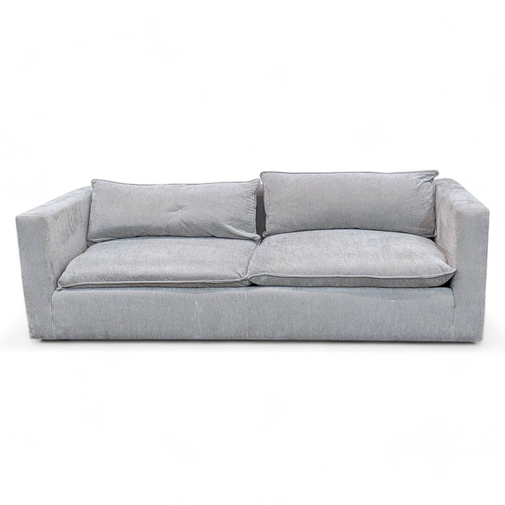 1. Dove grey Lotus low sofa with plush down blend pillows and flange detailing, 3-seat design by Crate & Barrel.