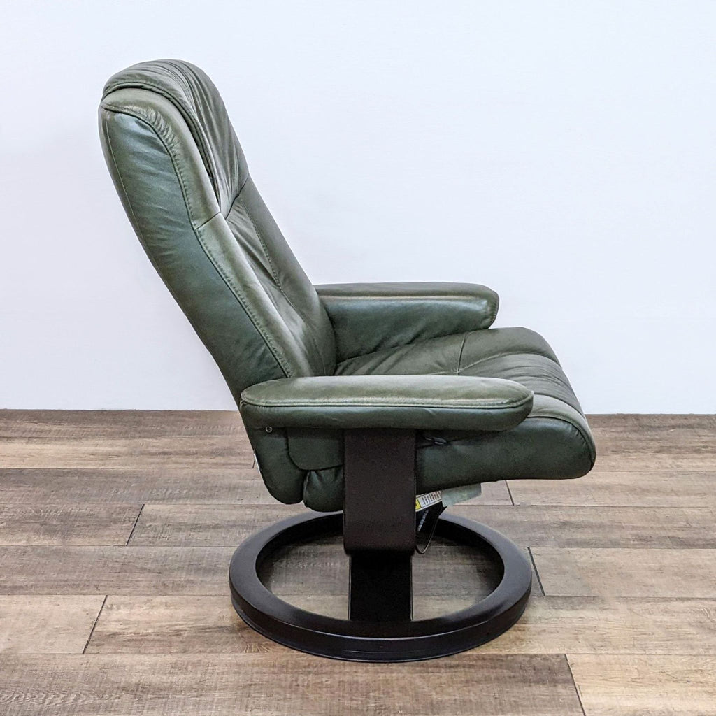 Side view of a forest green leather recliner with bentwood circular base, ideal for relaxation.
