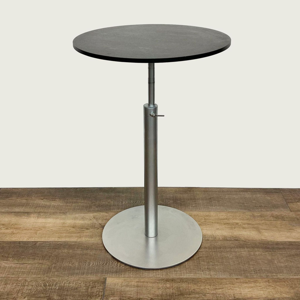 Adjustable-height Brio table by Lapalma, featuring a wood top and metal base, on a wooden floor.