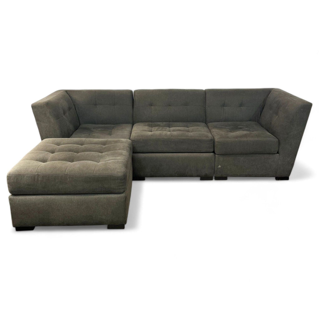 1. Grey fabric Jonathan Louis sectional, tufted design, four pieces with a movable ottoman for chaise versatility.