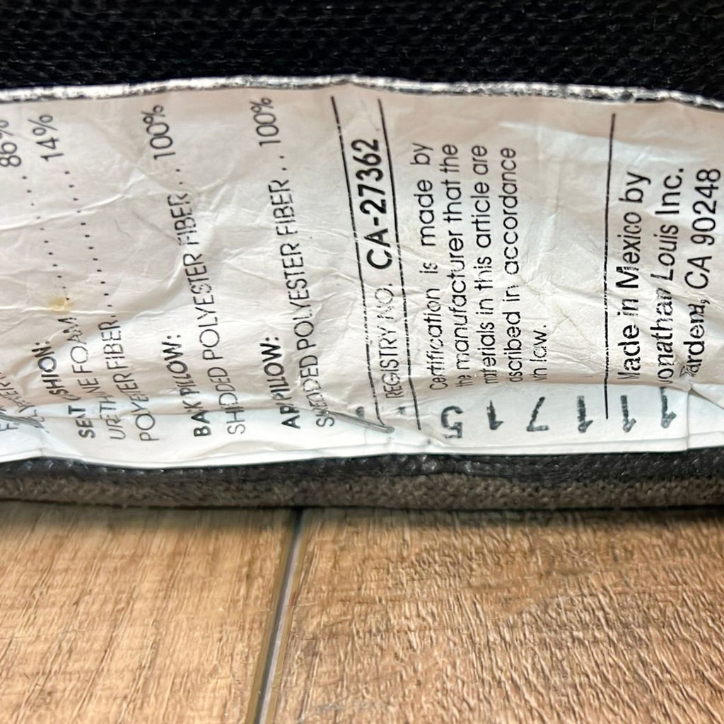 3. Cotton product label showing manufacturer Jonathan Louis, made in Mexico, and registration information for sectional.