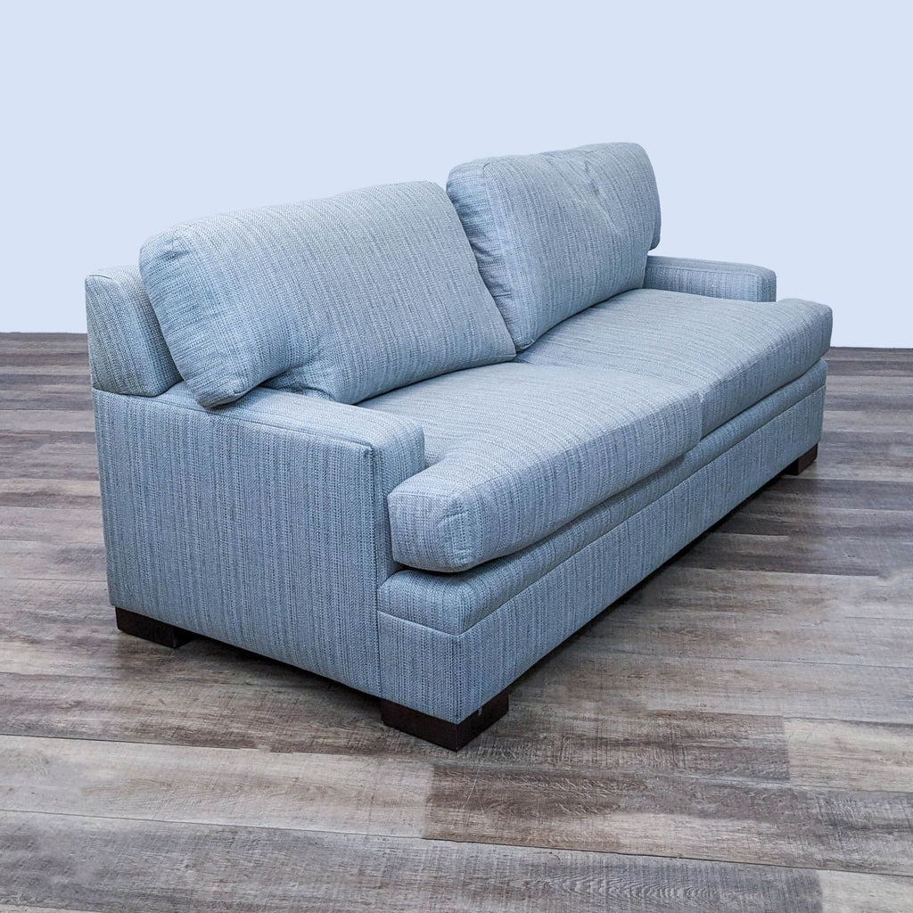 2. Angled view of a 78" designer upholstered 3-seat sofa by Kravet Furniture with T-back cushions and narrow track arms.
