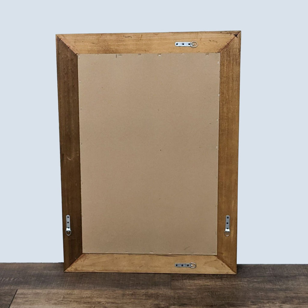 Back view of the mirror showing wall mounting hardware.