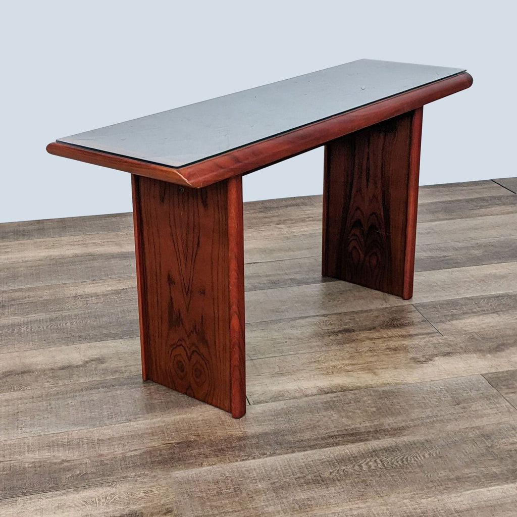 3. "Angled perspective of a mahogany Reperch side table with visible wood texture, placed on laminate flooring."