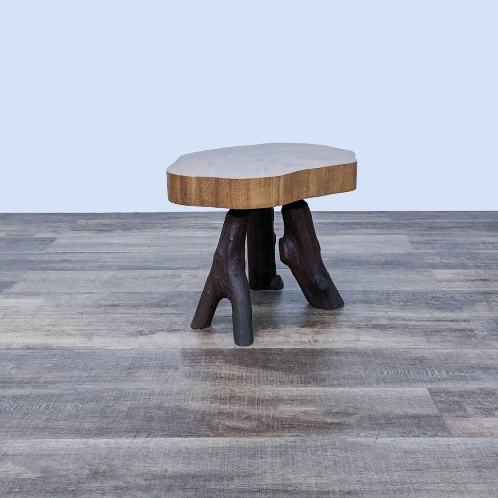 2. A unique Reperch console table featuring a live-edge top and sturdy tree trunk-style legs, displayed on textured flooring.