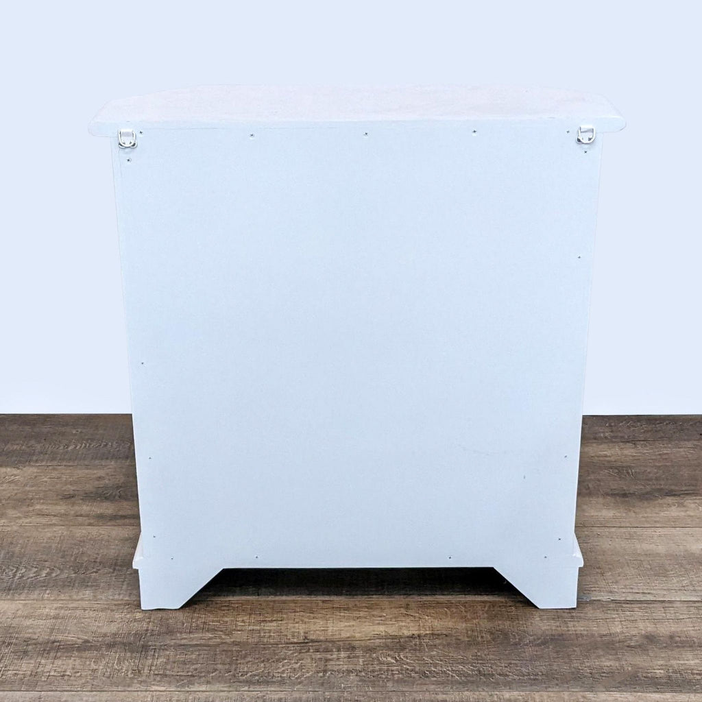 3. Rear view of Ballard Designs Piccola end table against a white background, highlighting the sturdy back panel and overall shape.