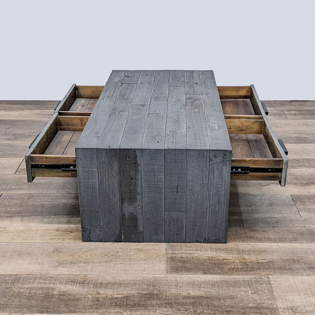 Living Spaces coffee table with four drawers opened, showcasing reclaimed pine construction in ash gray finish.