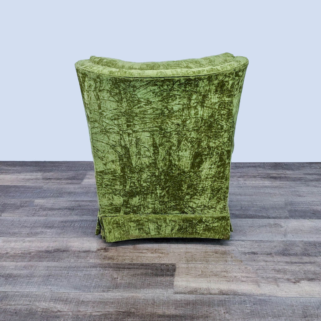 3. Rear view of a luxurious green velvet tufted lounge chair by Best Chairs Inc., displaying the chair's elegant back design.