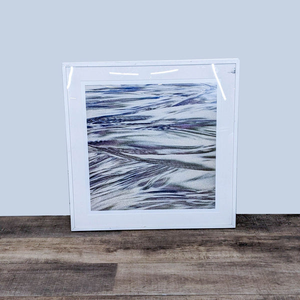 "Framed abstract Reperch art print with fluid blue and grey patterns on a white background."