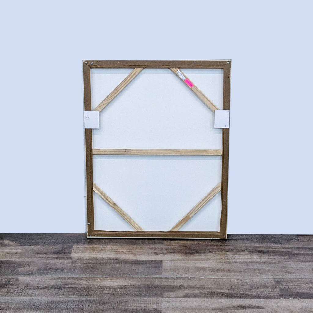 Back view of a large framed canvas with wood support. Brand: William Sonoma Home.