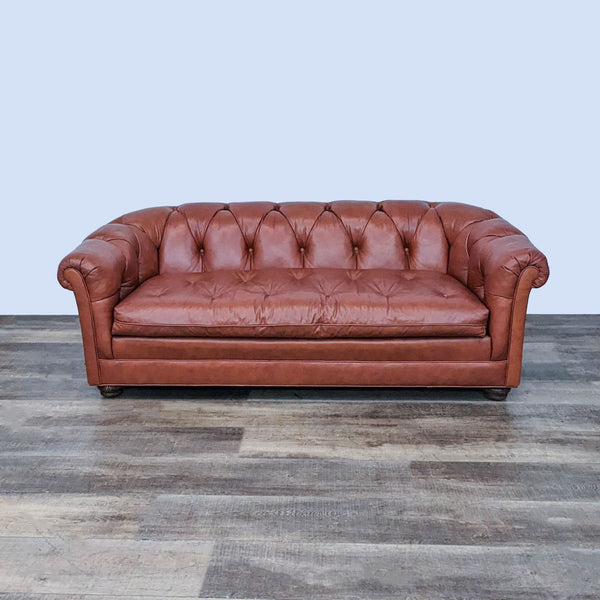 Handcrafted 3-seat North Hickory sofa with rolled arms and brown leather tufting, front view.