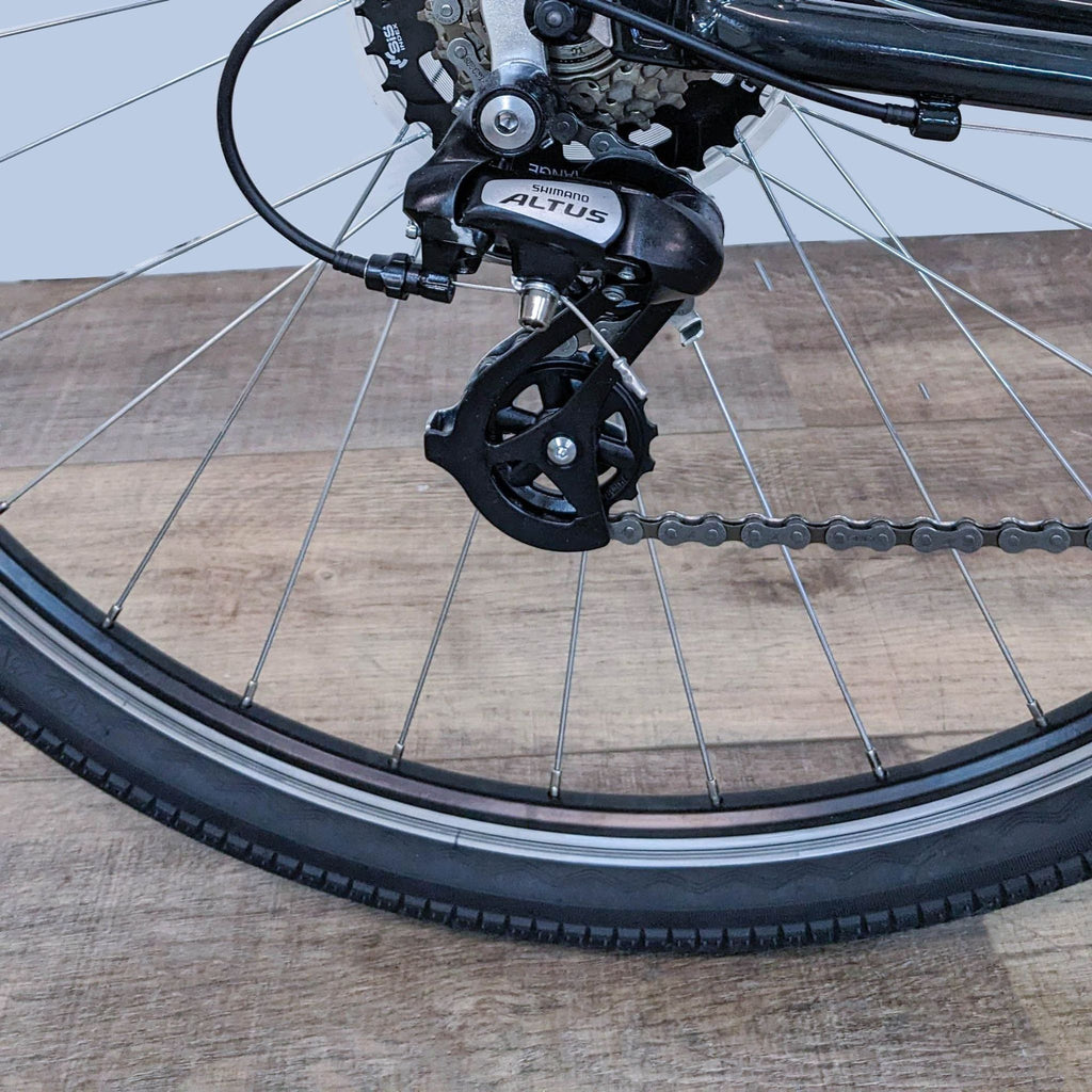 Detailed view of the IZIP bike's rear wheel and gear setup, enhancing urban navigation.