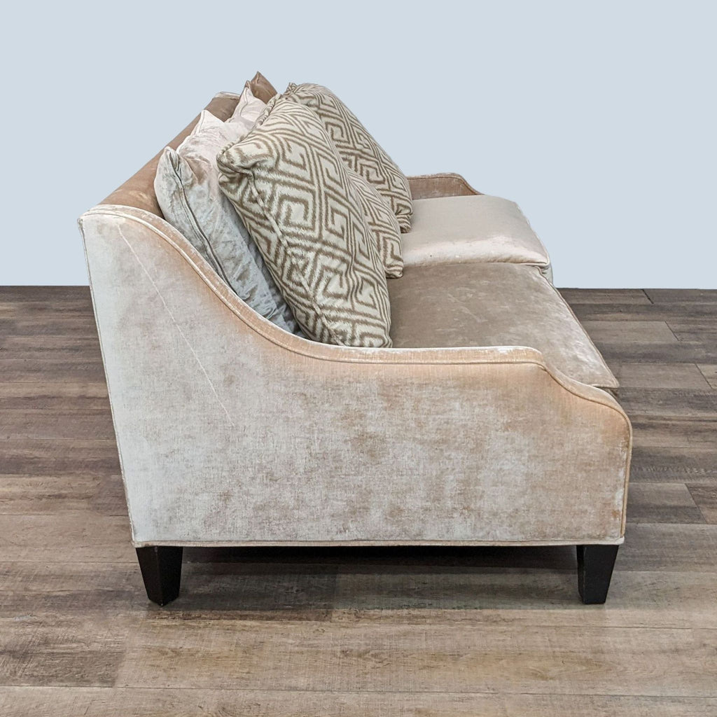 Neutral-toned Z Gallerie sofa featuring curved armrests and wooden legs.